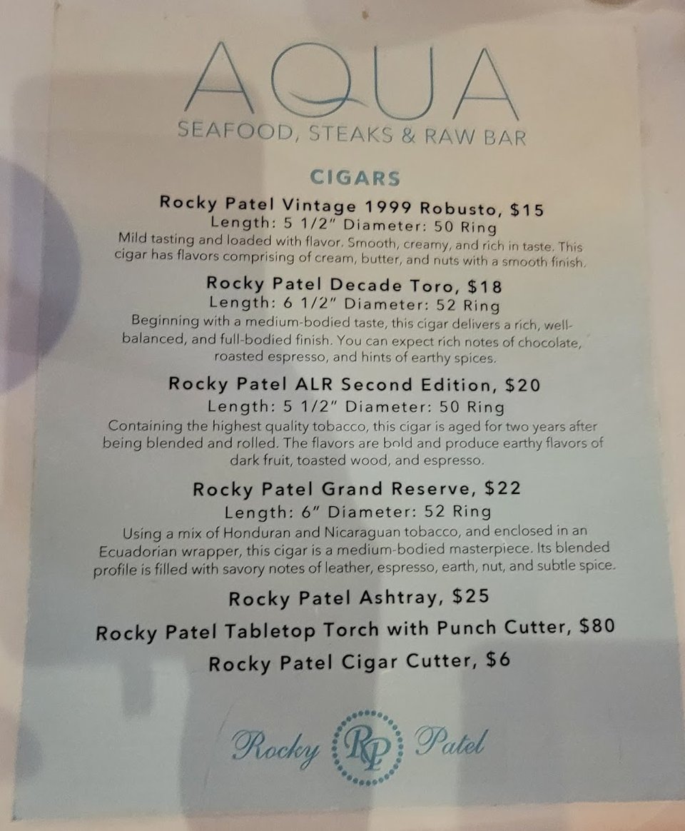 Printed menu with seafood, steaks, and cocktails.